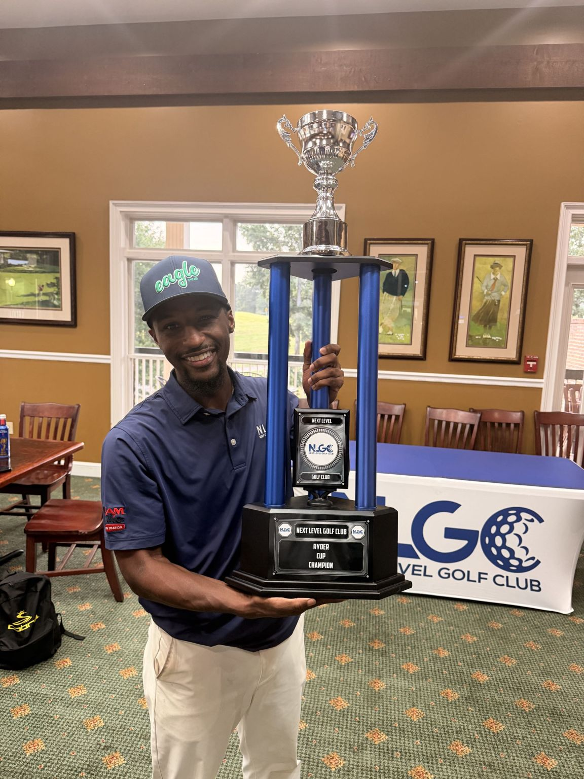 Supplied solo photograph of Benjamin holding a golf trophy